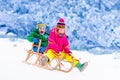 Kids having fun on sleigh ride Royalty Free Stock Photo