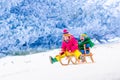 Kids having fun on sleigh ride Royalty Free Stock Photo