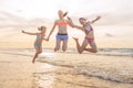 Kids having fun at sunset beach - friendship freedom beach Royalty Free Stock Photo