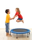 Kids having fun with a trampoline in the gym Royalty Free Stock Photo