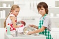 Kids having to do the dishes Royalty Free Stock Photo