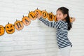 Kids help her family to hang up the decoration Royalty Free Stock Photo