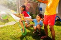 Group of kids play water gun fight game outside Royalty Free Stock Photo