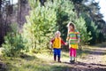 Kids hiking in autumn forest
