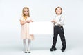 Kids holding blank card Royalty Free Stock Photo