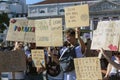 Kids holding placards and signs in a climate change protest march