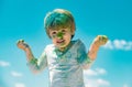 Kids Holi festival. Painted face of funny kid. Festival of colors. Little boy plays with colors. Royalty Free Stock Photo