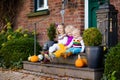 Kids at house porch on autumn day Royalty Free Stock Photo