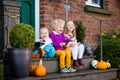 Kids at house porch on autumn day Royalty Free Stock Photo