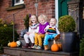 Kids at house porch on autumn day Royalty Free Stock Photo