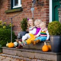 Kids at house porch on autumn day Royalty Free Stock Photo