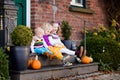 Kids at house porch on autumn day Royalty Free Stock Photo