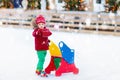 Kids ice skating in winter. Ice skates for child. Royalty Free Stock Photo