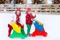 Kids ice skating in winter. Ice skates for child. Royalty Free Stock Photo