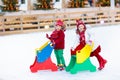 Kids ice skating in winter. Ice skates for child. Royalty Free Stock Photo