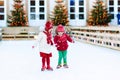 Kids ice skating in winter. Ice skates for child. Royalty Free Stock Photo