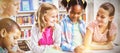 Kids interacting with each other in library Royalty Free Stock Photo