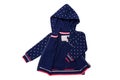 Kids jacket isolated. A stylish fashionable dark blue jacket with white dots and blue lining for the little girl. A sport jacket