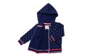 Kids jacket isolated. A stylish fashionable dark blue jacket with white dots and blue lining for the little girl. A sport jacket