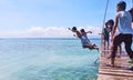 Kids jump on pair on a footbridge in a resort in Olango, taken on March 2018