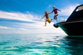 Child jumping into sea water. Yacht vacation Royalty Free Stock Photo