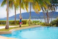 Kids jump into swimming pool. Summer water fun Royalty Free Stock Photo