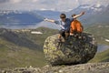 Kids jumping from big stone