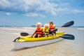 Kids kayaking in ocean. Children in kayak in tropical sea Royalty Free Stock Photo