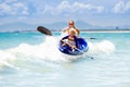 Kids kayaking in ocean. Children in kayak in tropical sea