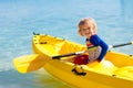 Kids kayaking in ocean. Family in kayak in tropical sea