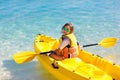 Kids kayaking in ocean. Family in kayak in tropical sea