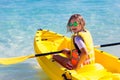 Kids kayaking in ocean. Family in kayak in tropical sea