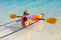 Kids kayaking in ocean. Family in kayak in tropical sea