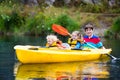 Kids kayaking on a river Royalty Free Stock Photo