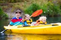 Kids kayaking on a river Royalty Free Stock Photo