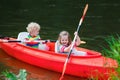 Kids kayaking in summer sport camp