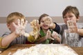 Kids kneading dough Royalty Free Stock Photo