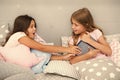 Kids lay in bed fight for book. Friends have some problems. Steps for dealing with sibling rivalry. There is no harm in