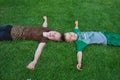 Kids laying on grass Royalty Free Stock Photo