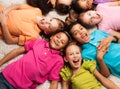 Kids laying in star shape Royalty Free Stock Photo