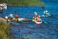 Kids learn kayaking, canoeing whitewater training in the lake river, children practicing paddling, yound kayakers in summer camp Royalty Free Stock Photo