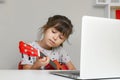 Kids learn music lessons online at home. Homeschooling and distance education for kids. Royalty Free Stock Photo