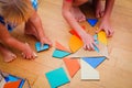 Kids learning -little boy and girl playing with geometric shapes