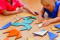 Kids learning -little boy and girl playing with geometric shapes