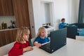 Kids learning remotely with father works from home, family stay idoors Royalty Free Stock Photo