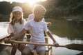 Kids learning to paddle canoe with their dad Royalty Free Stock Photo