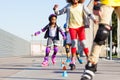 Kids learning to slalom skate with inline skates