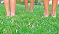 Kids legs on the grass