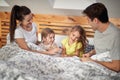 Kids like to sneak into a parent`s bed. Family, home, together