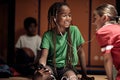 Kids listening to the music while waiting for a training. Children team sport